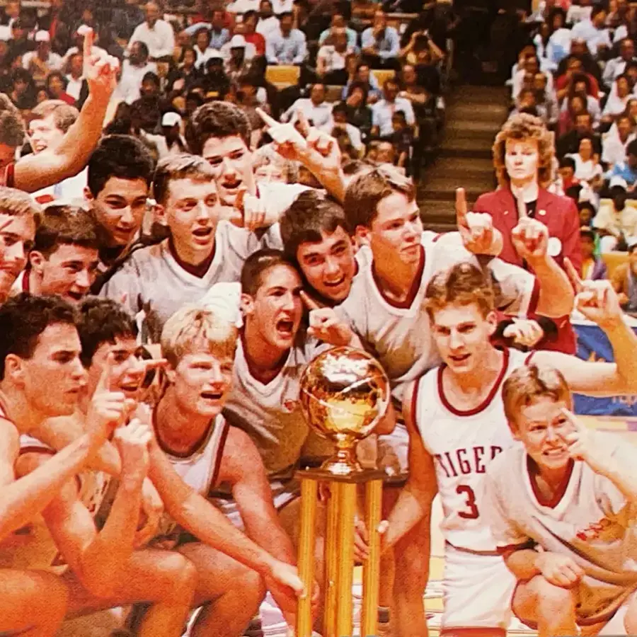 Dunham high school basketball athletes celebrating 1987 championship win.