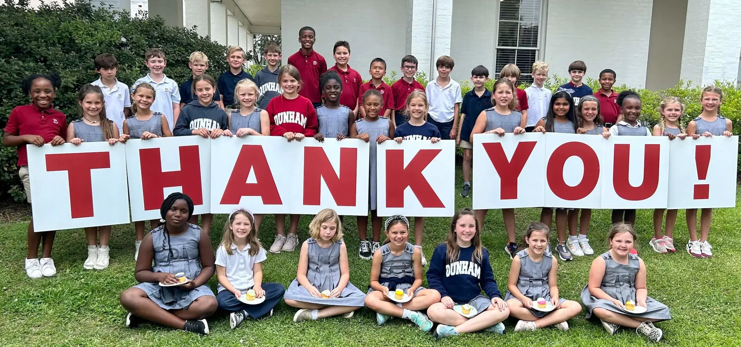 3rd grade class with thank you sign