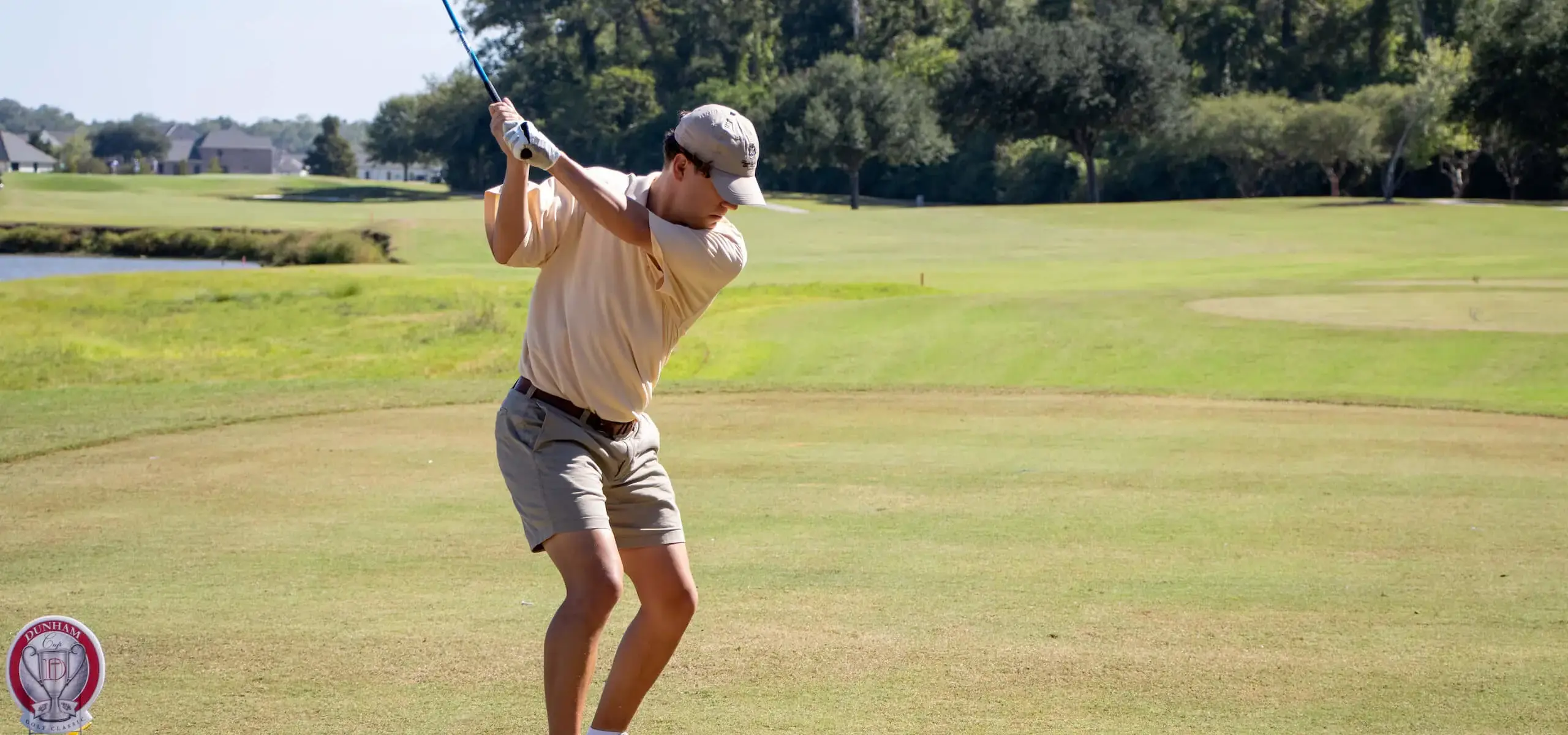 Golfer swinging his golf club at the Dunham Cup Golf Classic