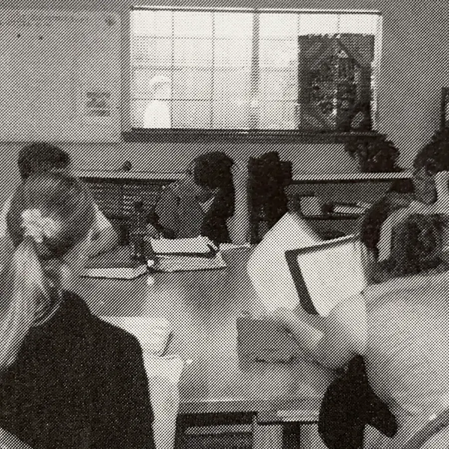 Dunham high school students discussing literature around a round harkness table