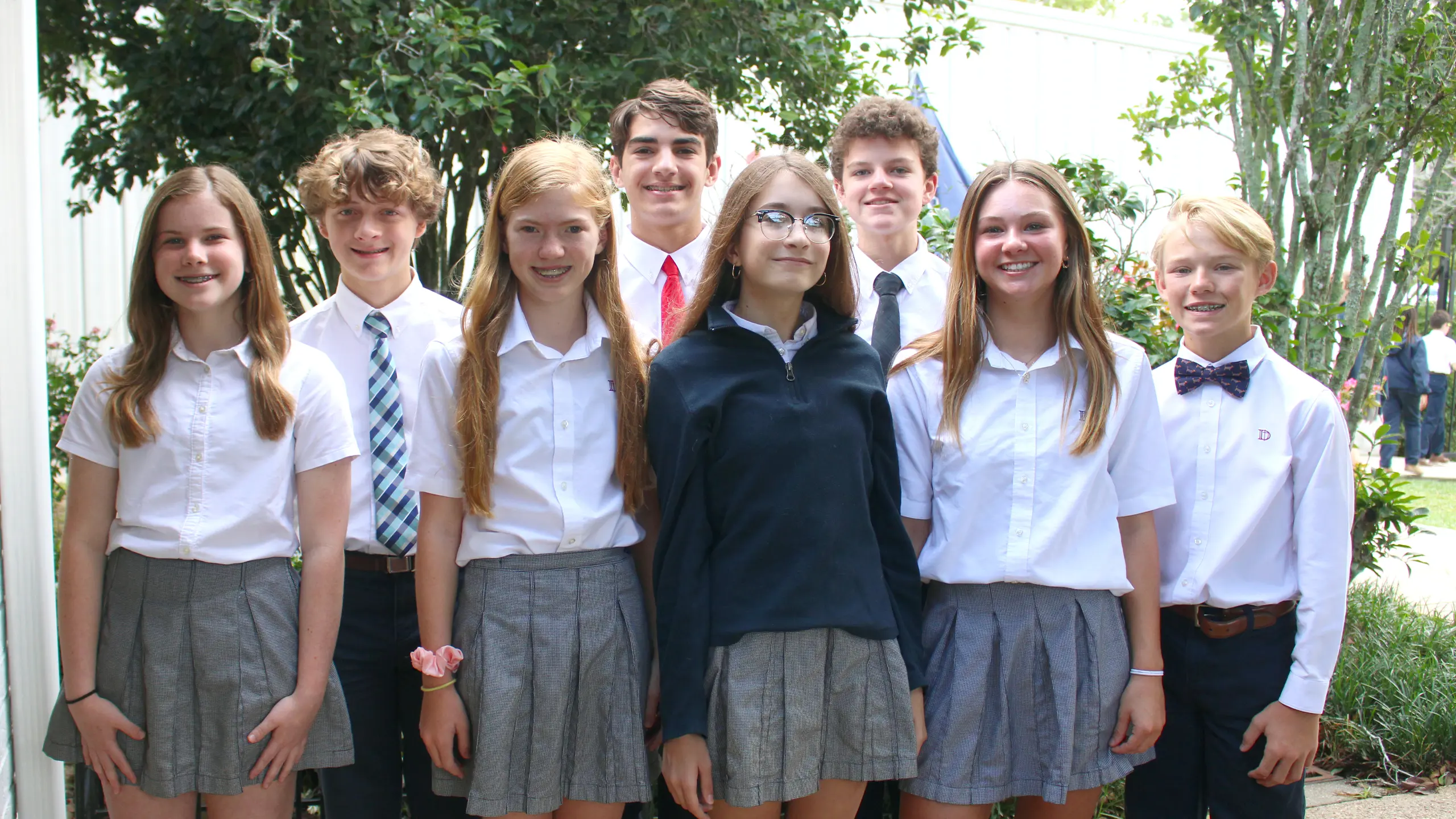 Large group of Middle School house captains standing in garden