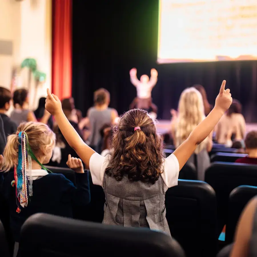 A Dunham elementary school girl worshipping during weekly chapel