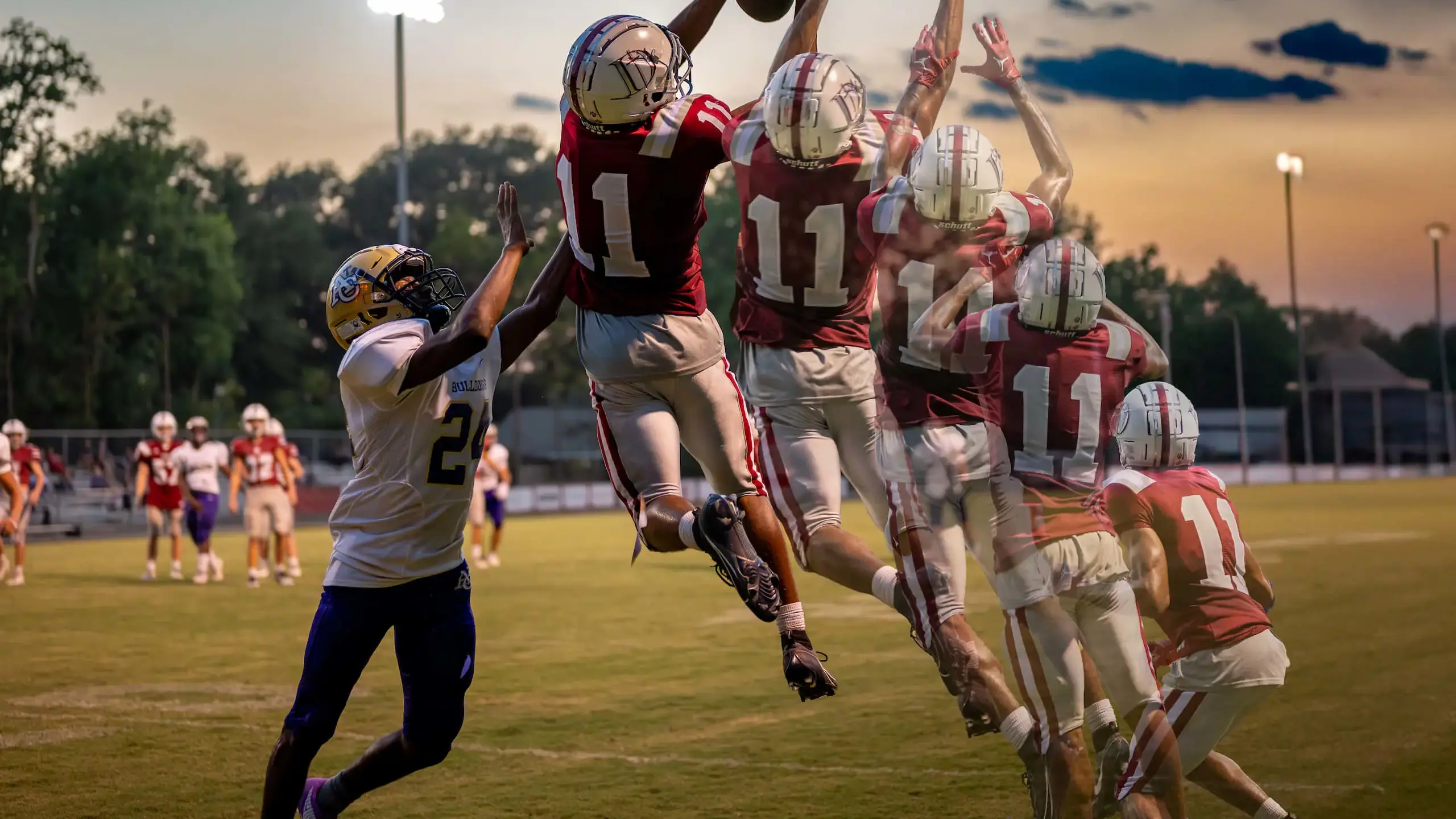 A photo of a Dunham football player catching the ball during a junior varsity football game in Baton Rouge