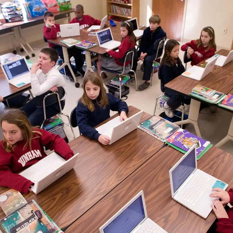 Dunham elementary school students using Apple Macbooks in classroom