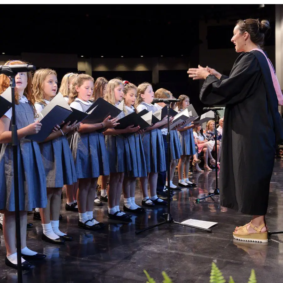 Dunham lower school choir performing at graduation.