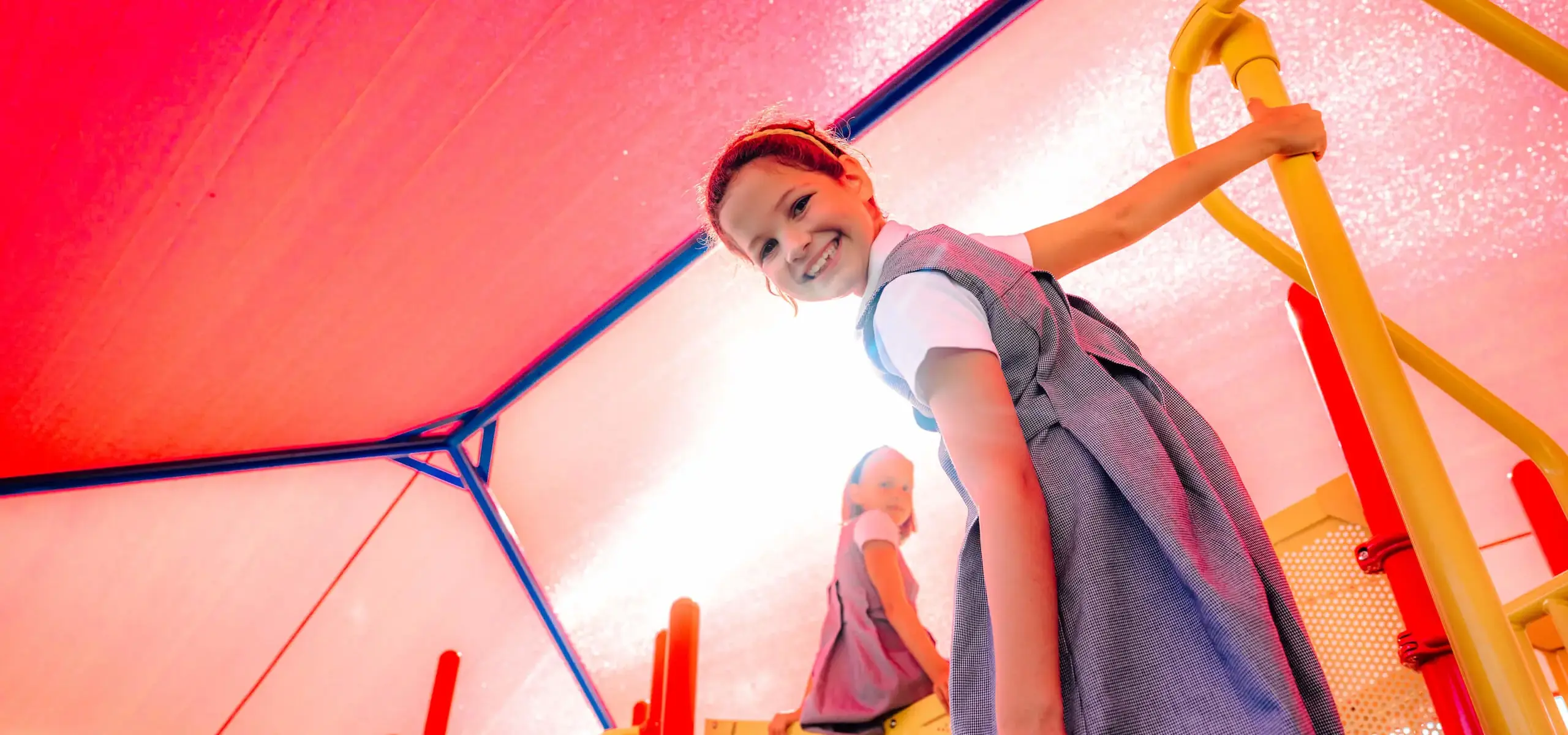 Dunham elementary school girl playing on new playground equipment.