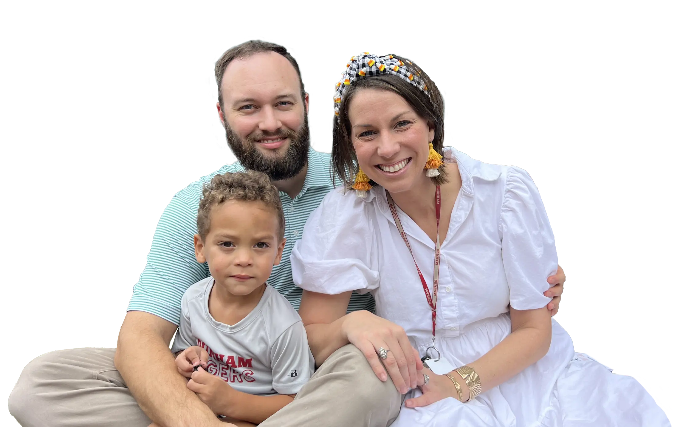 Two Dunham parents with their child smiling