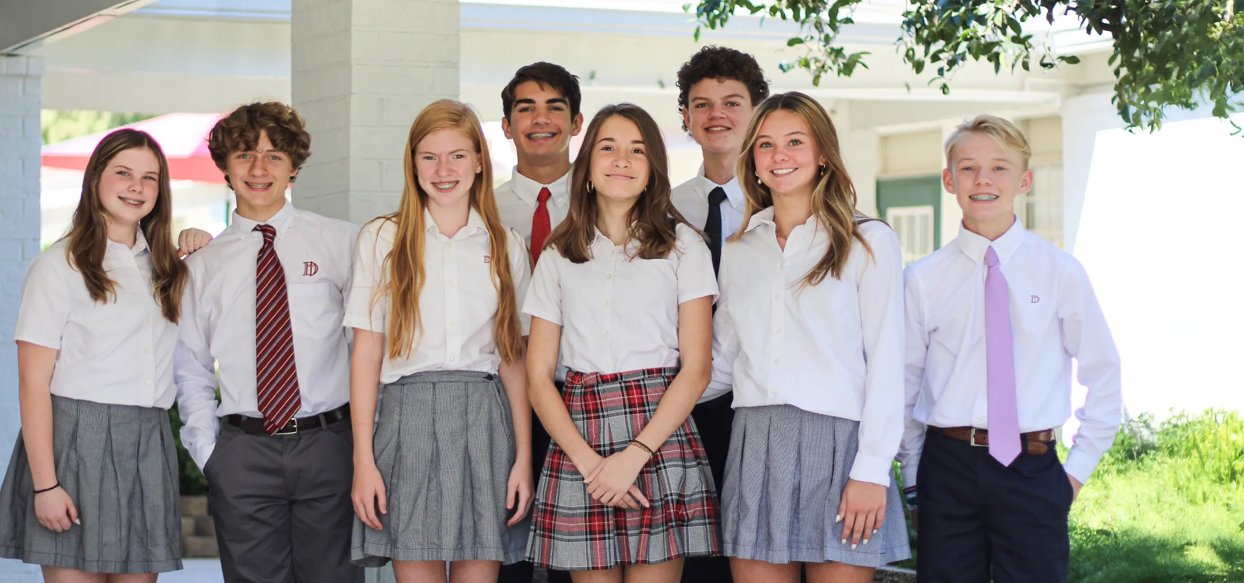 Large group of Middle School house captains standing in garden