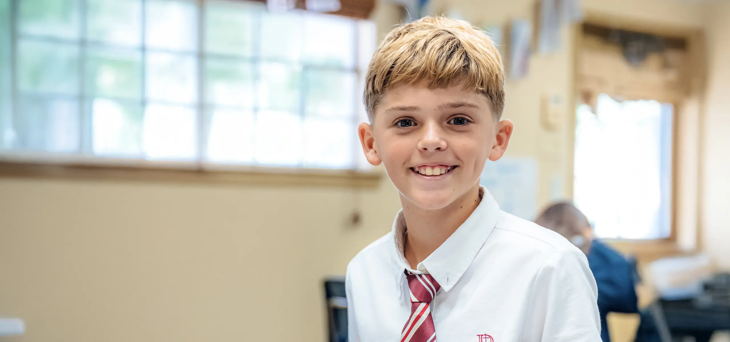 Middle school student in classroom.