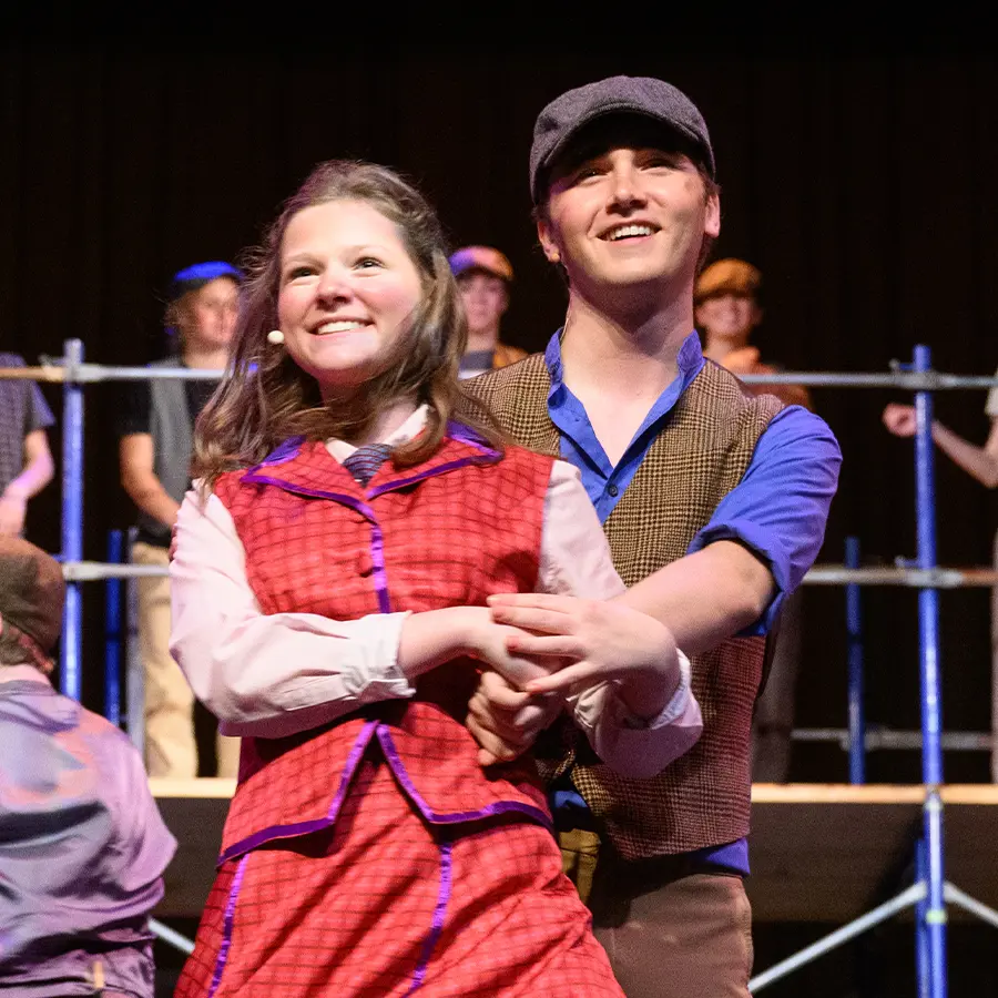 Two performances dancing in upper school musical.