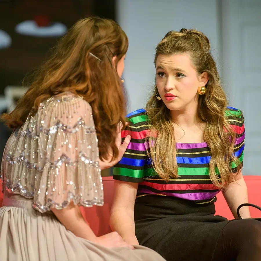 Two Dunham upper school actresses performing in play. 