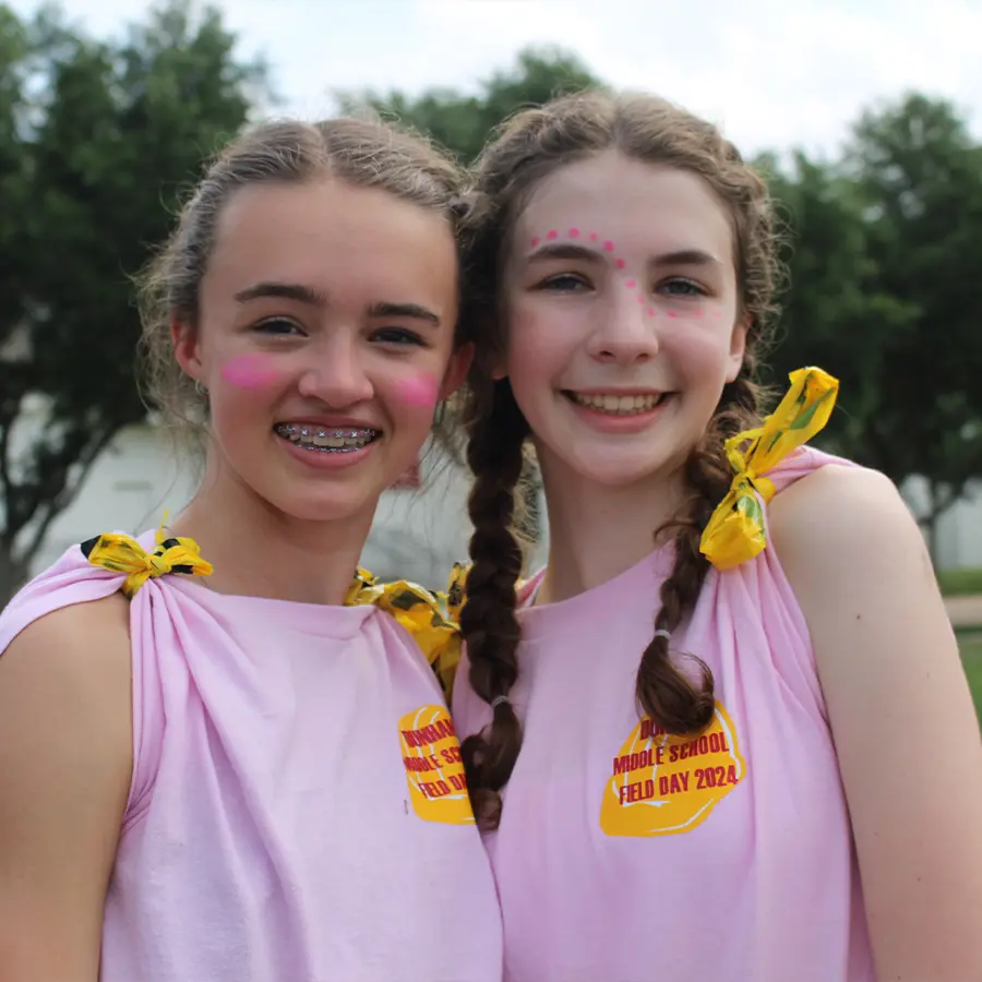 Two Dunham Middle School girls smiling together at Field Day.